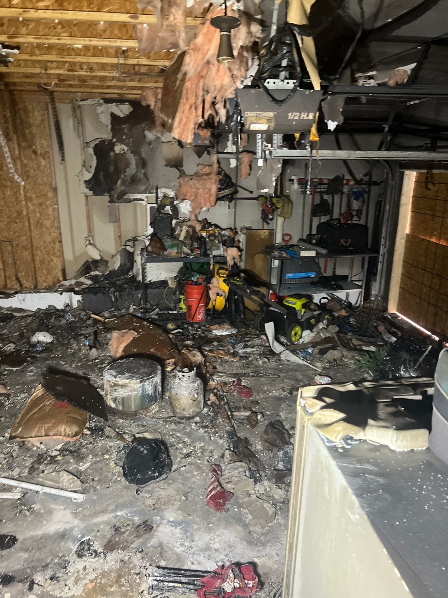 Extensive fire damage inside a Portland garage cleared by IRS crew